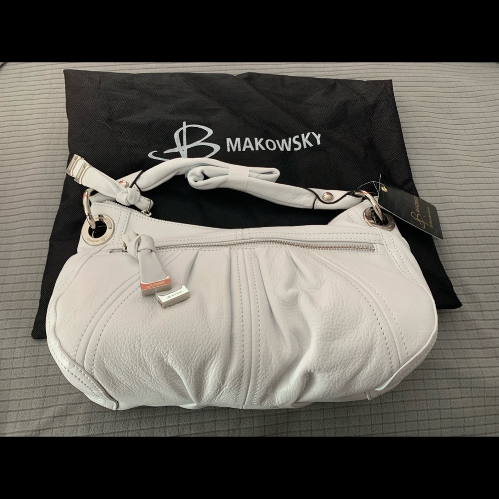 Brand new B. Makowsky purse with dust cover.